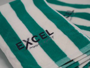 Embroidery Excel Property logo on Green & White Towells